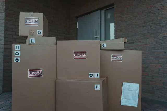 Inbound cartons with fragile labels staged for receiving at our Houston FBA prep center